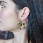 Gold filled hoop earrings embroidered with a variety of different shaped olive green fresh water pearls