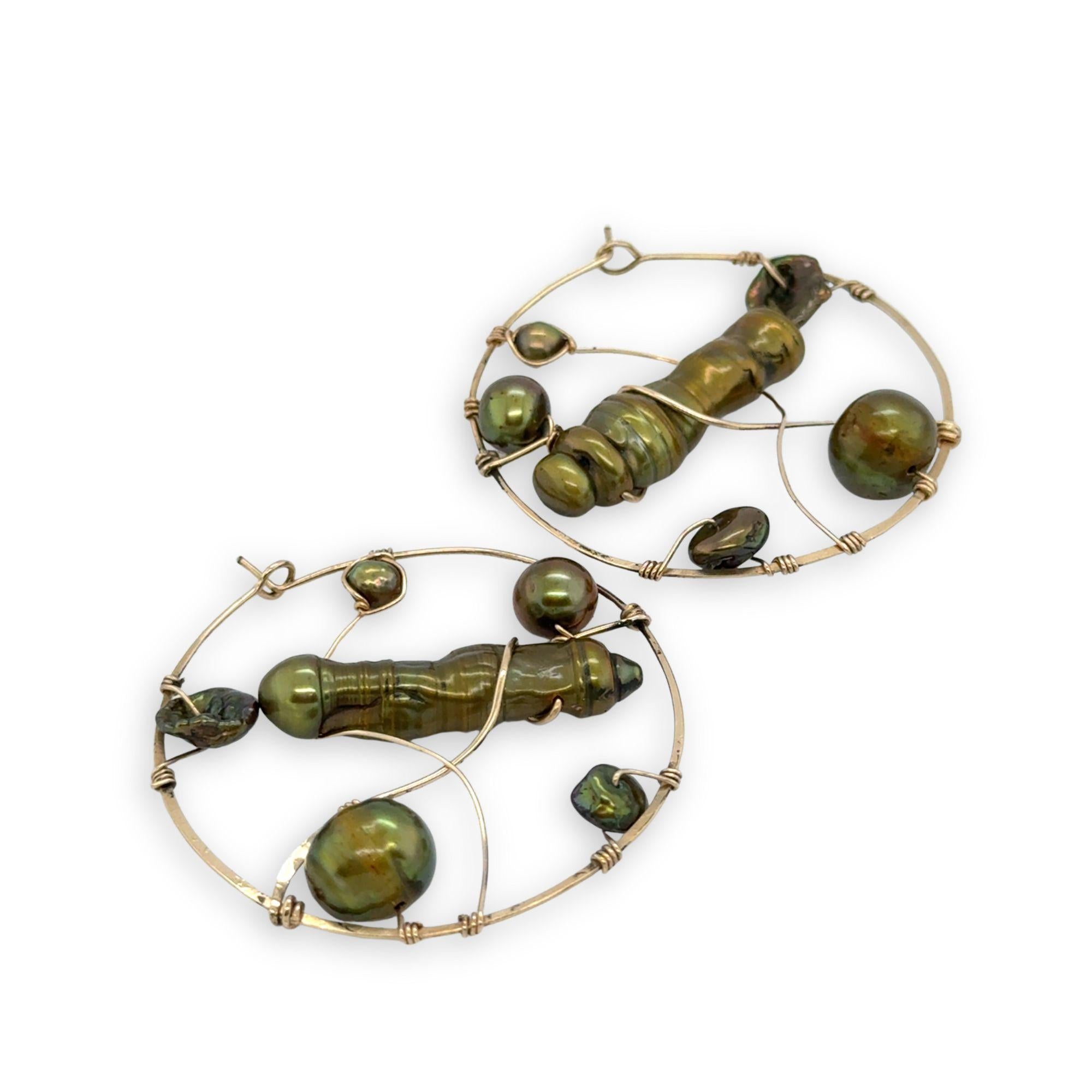 Gold filled hoop earrings embroidered with a variety of different shaped olive green fresh water pearls