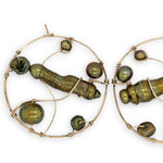 Gold filled hoop earrings embroidered with a variety of different shaped olive green fresh water pearls