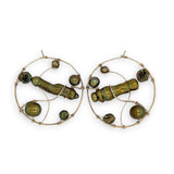 Gold filled hoop earrings embroidered with a variety of different shaped olive green fresh water pearls