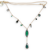Green onyx, green goldstone, and green cubic zirconia gemstones accent a gold filled delicate chain with oxidized sterling silver charms necklace