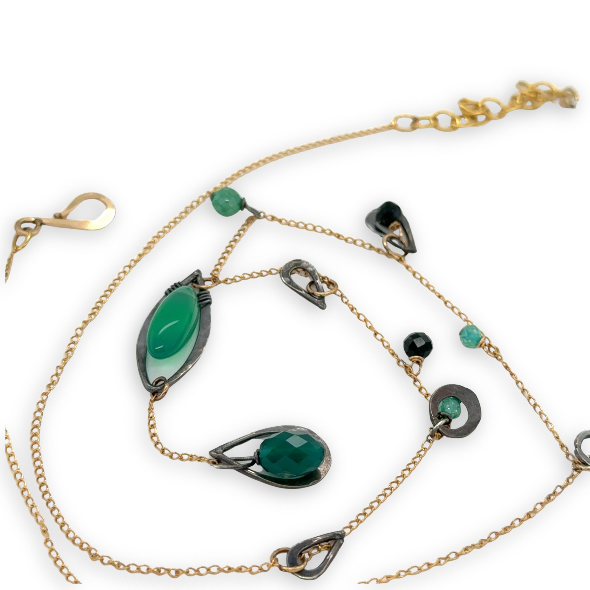 Green onyx, green goldstone, and green cubic zirconia gemstones accent a gold filled delicate chain with oxidized sterling silver charms necklace