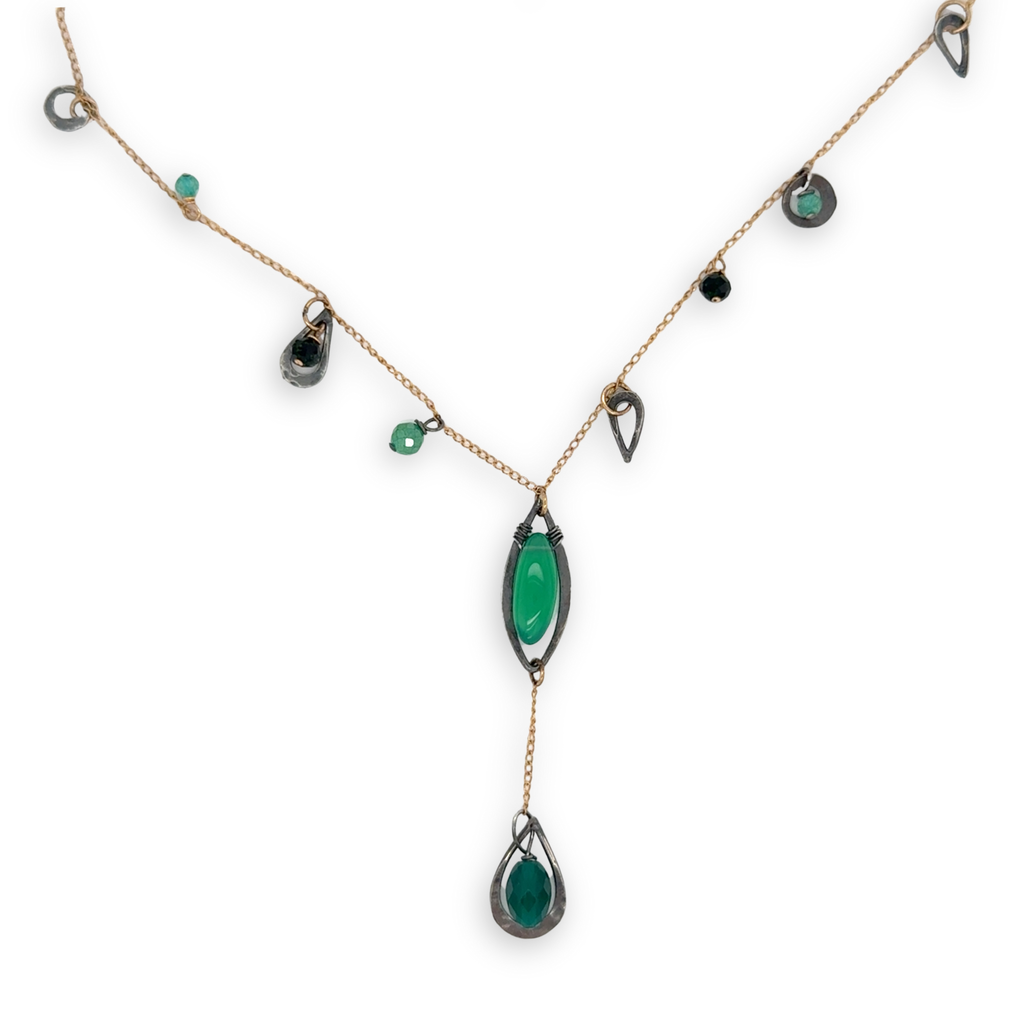 Green onyx, green goldstone, and green cubic zirconia gemstones accent a gold filled delicate chain with oxidized sterling silver charms necklace