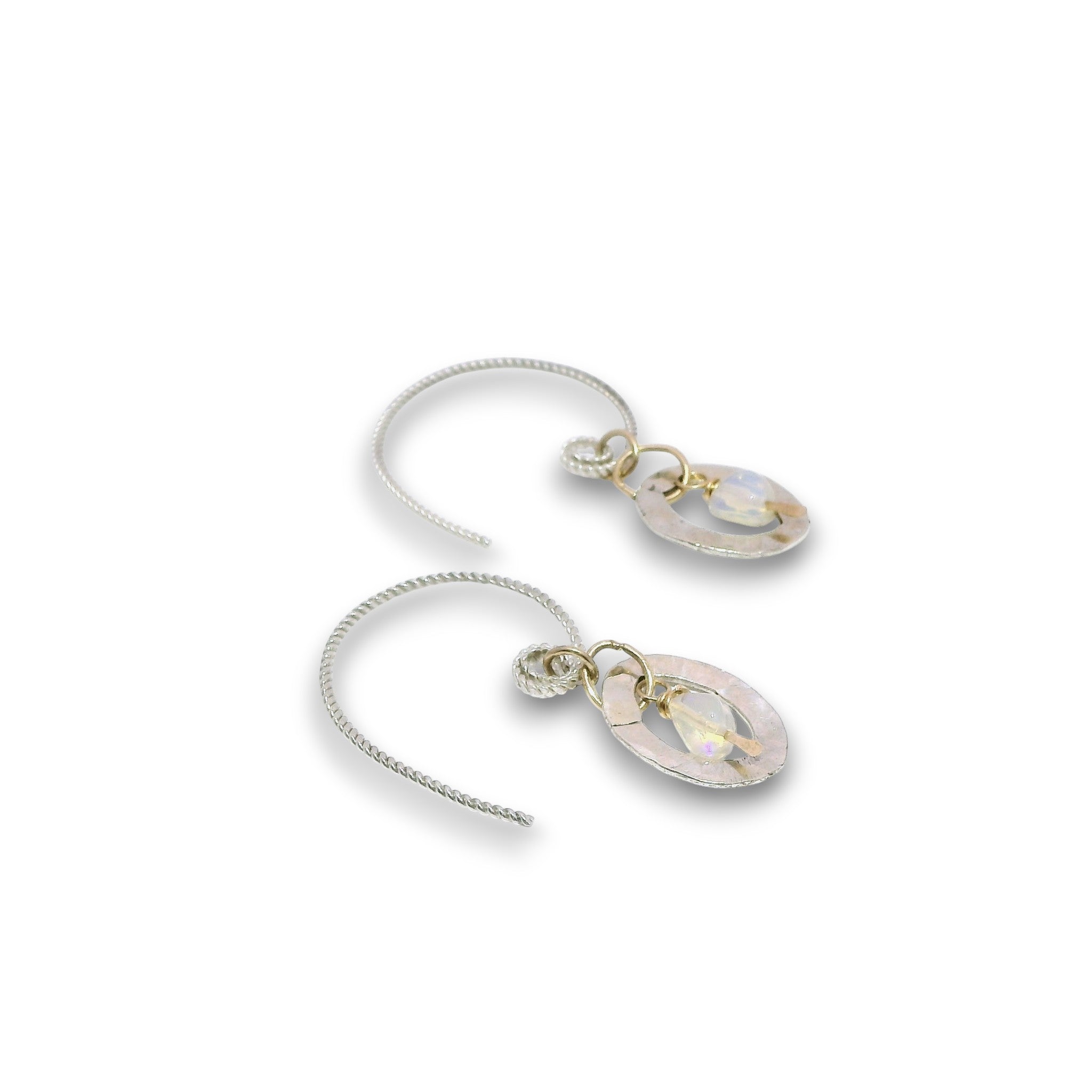 Opal gemstone nuggets dangle within a mini sterling silver hammered oval, hanging from our handmade braided sterling silver earring hoops