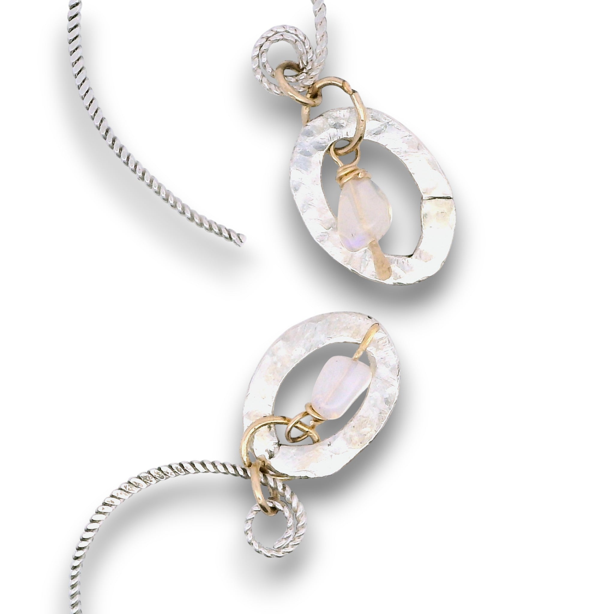 Opal gemstone nuggets dangle within a mini sterling silver hammered oval, hanging from our handmade braided sterling silver earring hoops