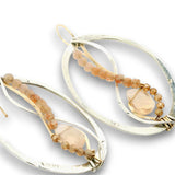 Sterling silver oval earrings stamped with florals, with pink opal mini drop gemstones, sunstone cubes, and cubic zirconia gemstones on gold filled earring hooks