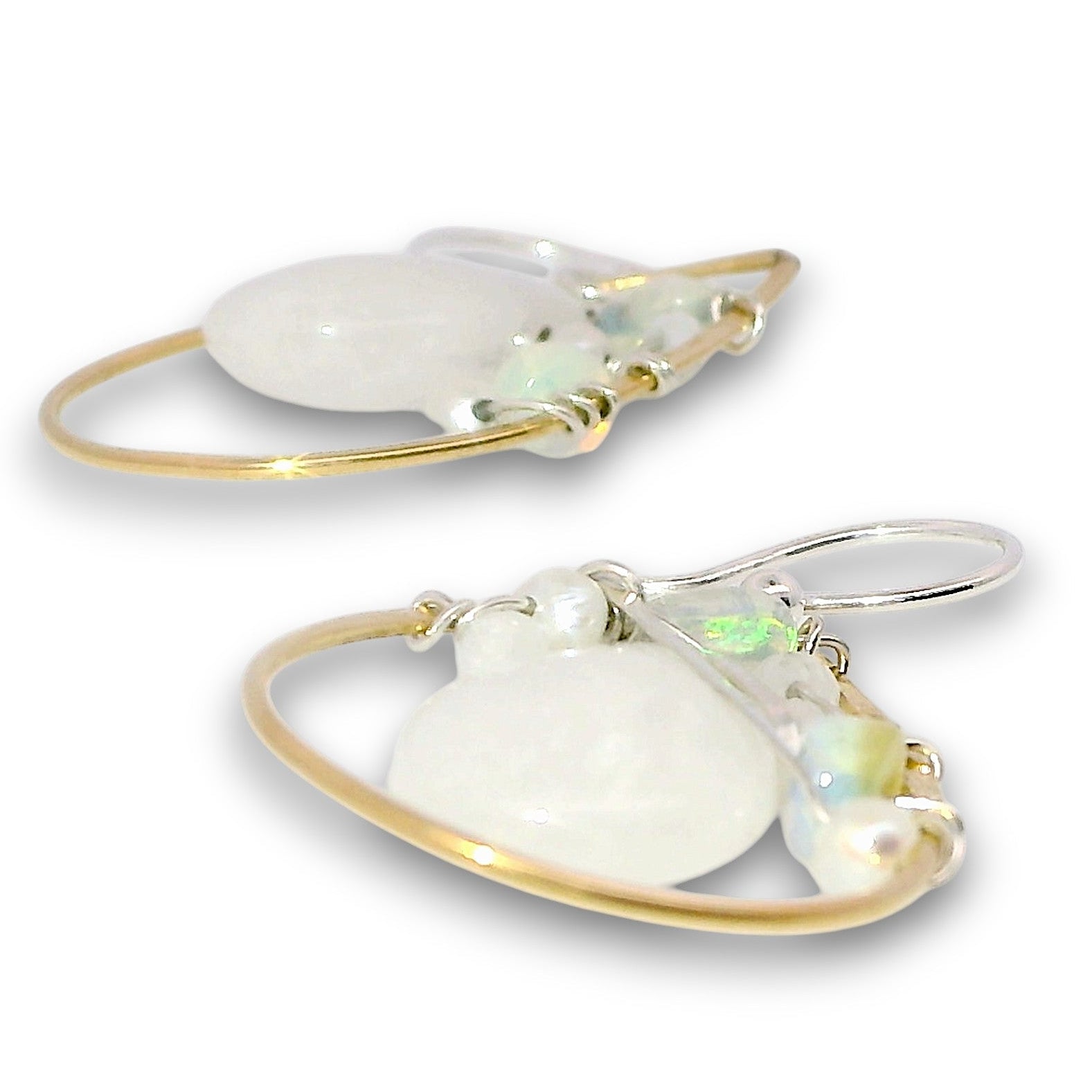 Brass teardrop shaped earrings embellished with white jade, moonstone, fresh water pearls, and opal gemstones on hammered sterling silver wire