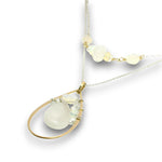 Double necklace with a sterling silver chain, the first layer with opal, moonstone and pearls, and the second layer with a brass teardrop shaped pendant filled with a whiten jade drop, opal, moonstone, and fresh water pearl accents