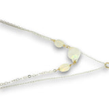 Double necklace with a sterling silver chain, the first layer with opal, moonstone and pearls, and the second layer with a brass teardrop shaped pendant filled with a whiten jade drop, opal, moonstone, and fresh water pearl accents