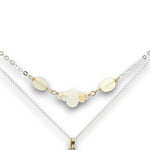 Double necklace with a sterling silver chain, the first layer with opal, moonstone and pearls, and the second layer with a brass teardrop shaped pendant filled with a whiten jade drop, opal, moonstone, and fresh water pearl accents