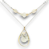 Double necklace with a sterling silver chain, the first layer with opal, moonstone and pearls, and the second layer with a brass teardrop shaped pendant filled with a whiten jade drop, opal, moonstone, and fresh water pearl accents