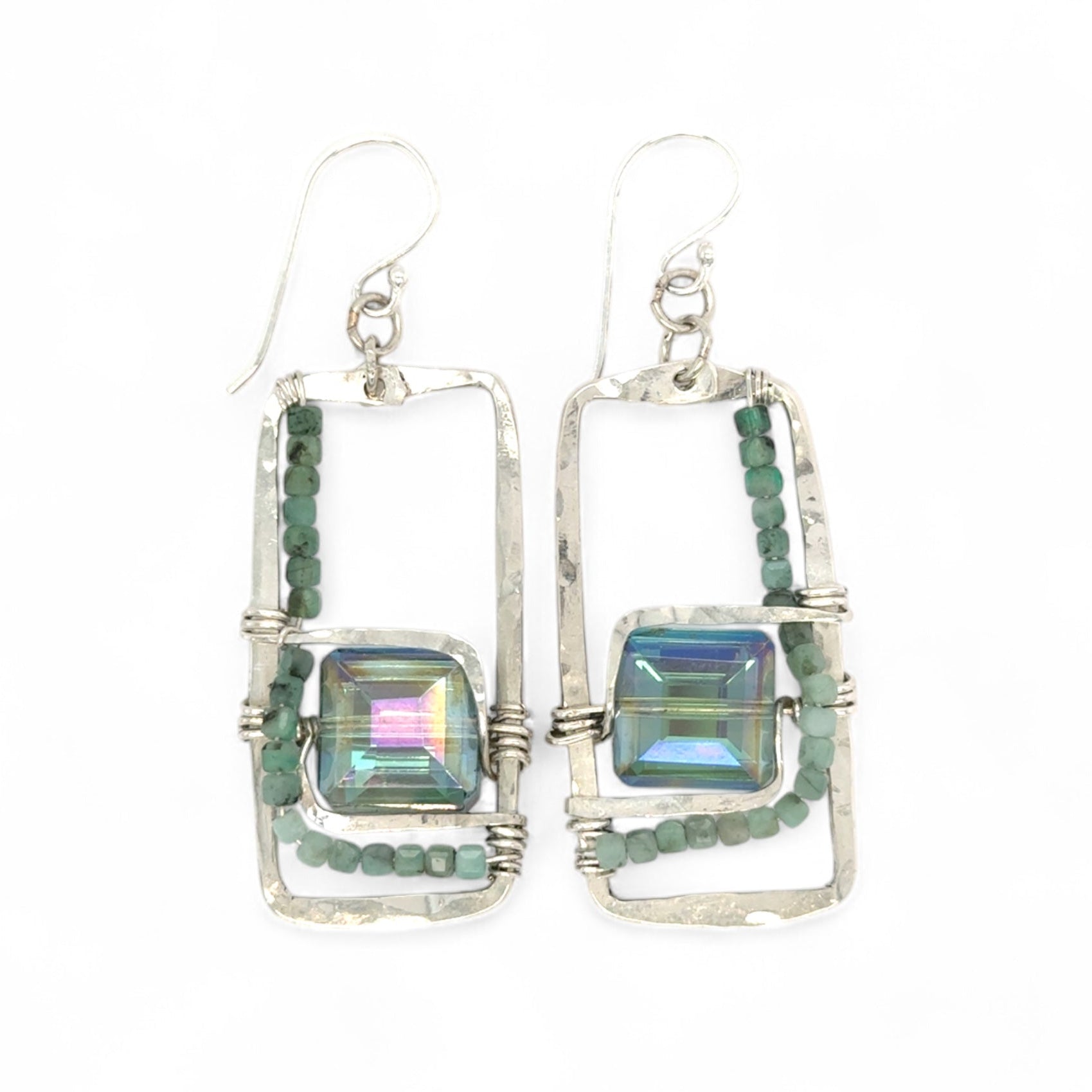 A pair of sterling silver hammered rectangle earrings with square cut blue-green crystals and faceted emerald gemstone cubes.