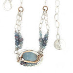 Sterling silver oval pendant with aquamarine nugget wrapped in bronze hammered wire with blue zoisite, and crystal gemstones on a sterling silver chain necklace