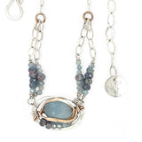 Sterling silver oval pendant with aquamarine nugget wrapped in bronze hammered wire with blue zoisite, and crystal gemstones on a sterling silver chain necklace