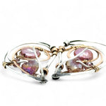 Tree stamped sterling silver oxidized paisley shaped earrings with bronze hammered twists, pink fresh water pearl coins and magenta crystals with built in earring hooks that wear like a post earring