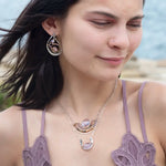 Tree stamped sterling silver oxidized paisley shaped earrings with bronze hammered twists, pink fresh water pearl coins and magenta crystals with built in earring hooks that wear like a post earring