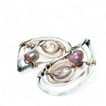 Tree stamped sterling silver oxidized paisley shaped earrings with bronze hammered twists, pink fresh water pearl coins and magenta crystals with built in earring hooks that wear like a post earring