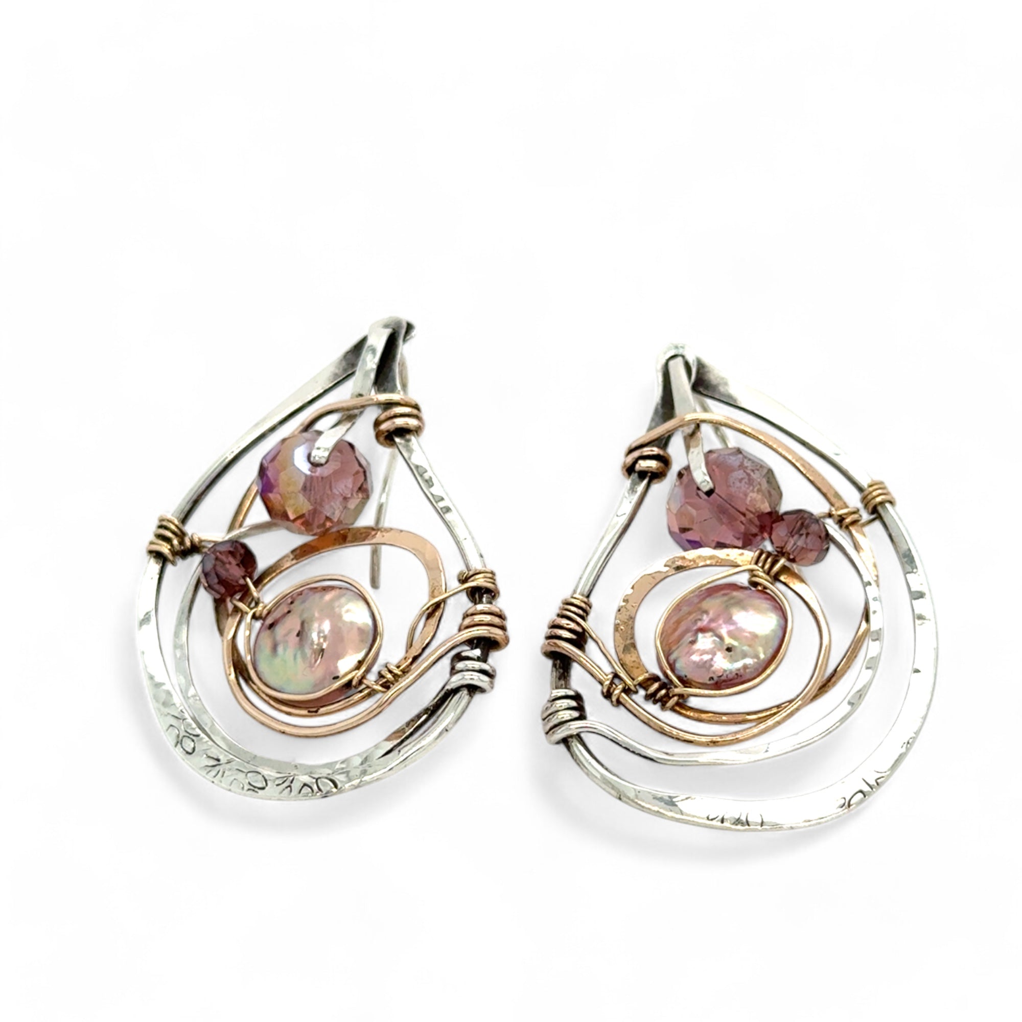 Tree stamped sterling silver oxidized paisley shaped earrings with bronze hammered twists, pink fresh water pearl coins and magenta crystals with built in earring hooks that wear like a post earring