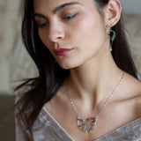 A pair of dark sterling silver mini open hoop earrings with tourmaline and new jade mini drop gemstones, featuring a oxidized sterling silver delicate chain