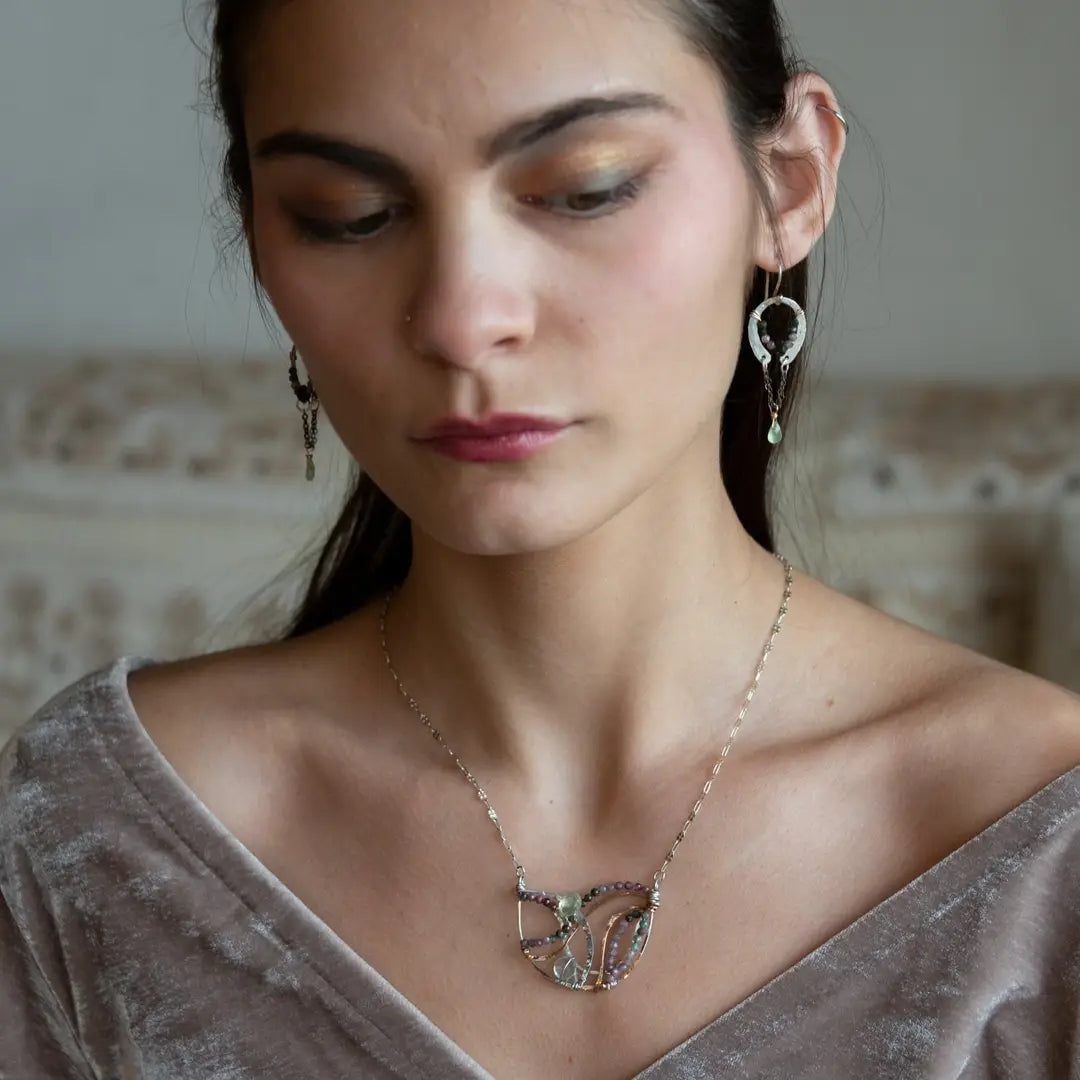A pair of dark sterling silver mini open hoop earrings with tourmaline and new jade mini drop gemstones, featuring a oxidized sterling silver delicate chain