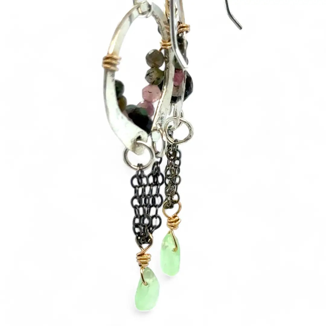 A pair of dark sterling silver mini open hoop earrings with tourmaline and new jade mini drop gemstones, featuring a oxidized sterling silver delicate chain