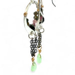 A pair of dark sterling silver mini open hoop earrings with tourmaline and new jade mini drop gemstones, featuring a oxidized sterling silver delicate chain