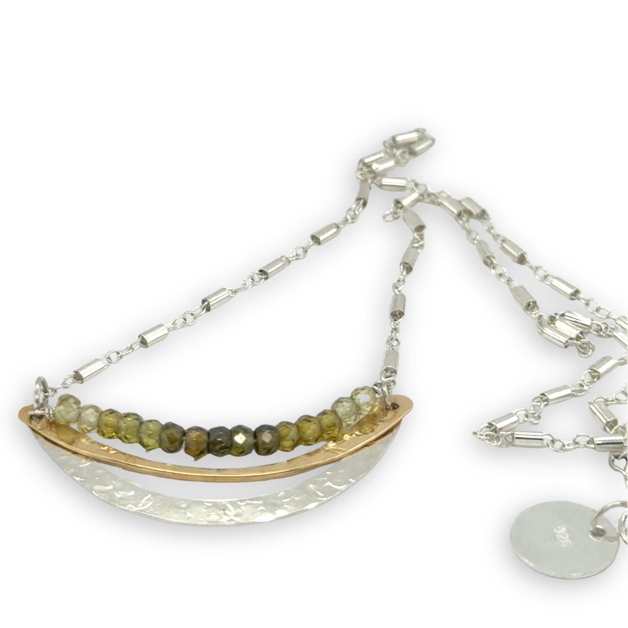 Stamped sterling silver and brass crescent necklace lines with ombre green faceted cubic zirconia gemstones