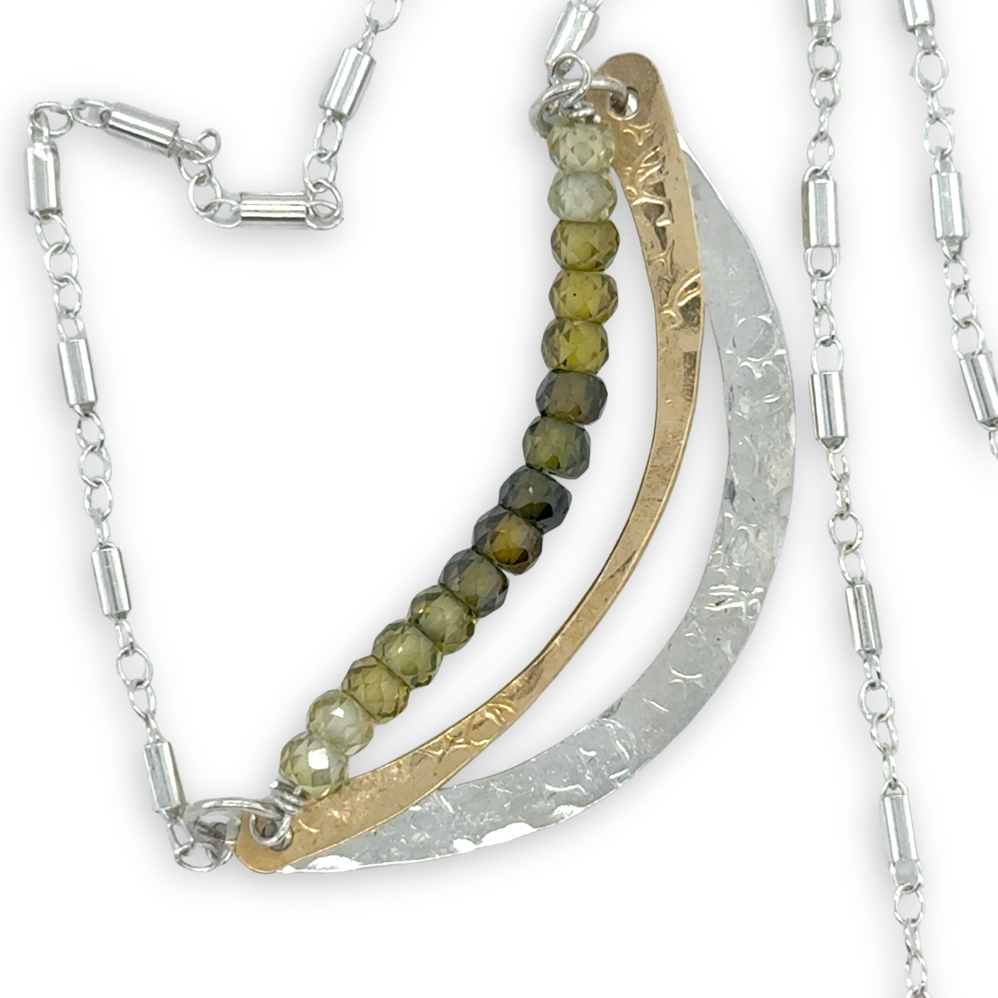 Stamped sterling silver and brass crescent necklace lines with ombre green faceted cubic zirconia gemstones