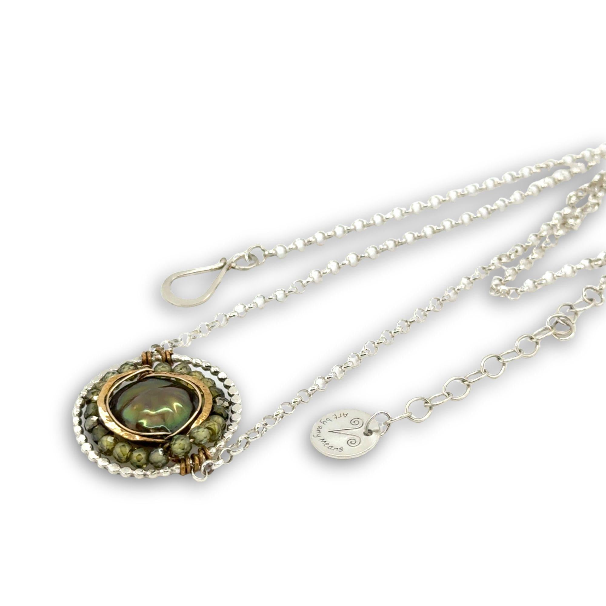 sterling silver dot wire ring pendant with olive green fresh water pearl coin surrounded by hammered brass and green cubic zirconia and pyrite necklace