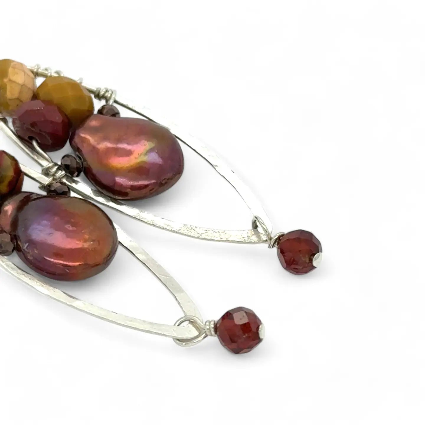 A pair of lightweight sterling silver marquise frame earrings, featuring faceted mookite jasper , hessonite gemstones, and a rich red fresh water pearl drop.