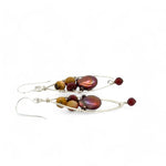 A pair of lightweight sterling silver marquise frame earrings, featuring faceted mookite jasper , hessonite gemstones, and a rich red fresh water pearl drop.