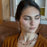 A pair of lightweight sterling silver marquise frame earrings, featuring faceted mookite jasper , hessonite gemstones, and a rich red fresh water pearl drop.