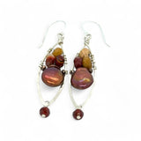 A pair of lightweight sterling silver marquise frame earrings, featuring faceted mookite jasper , hessonite gemstones, and a rich red fresh water pearl drop.