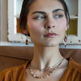 A pair of lightweight sterling silver marquise frame earrings, featuring faceted mookite jasper , hessonite gemstones, and a rich red fresh water pearl drop.