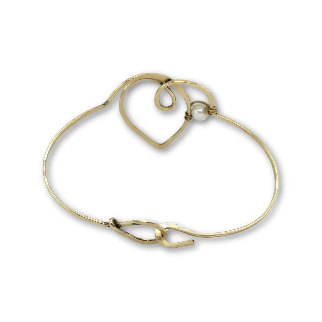 Hammered brass heart bracelet with a singular round fresh water pearl accent