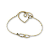 Hammered brass heart bracelet with a singular round fresh water pearl accent