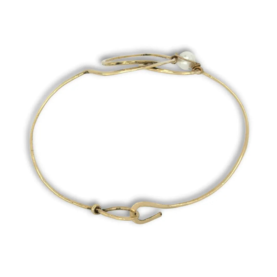 Hammered brass heart bracelet with a singular round fresh water pearl accent
