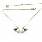 A gold-filled chain necklace with a boat-shaped brass pendant featuring a freshwater pearl stick and aquamarine gemstones at the bow and stern.