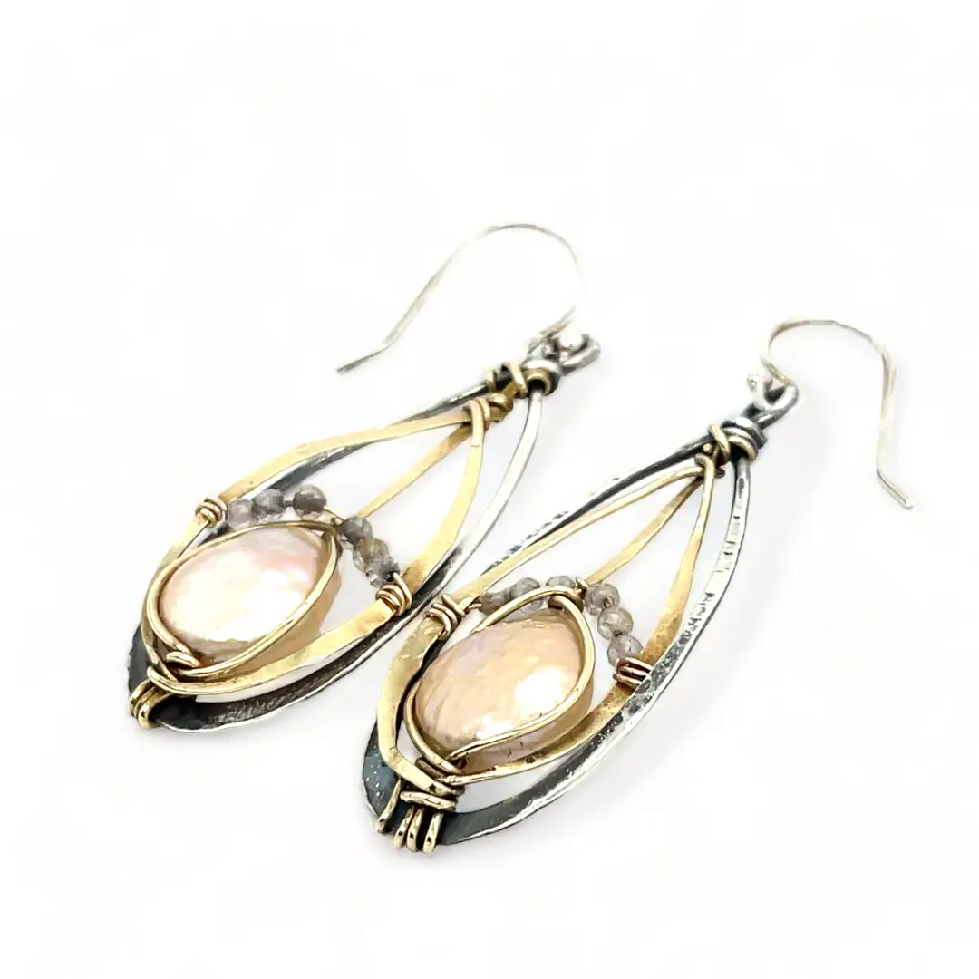 A pair of pearl drop earrings with hammered brass and oxidized sterling silver, featuring micro faceted rutilated quartz details.