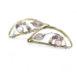 Leaf stamped brass semi circle earrings with sterling silver and gold filled wire details, featuring rose quartz, pink tourmaline, pink opal, and a pink fresh water pearl with built in earring hooks that wear like a post earring