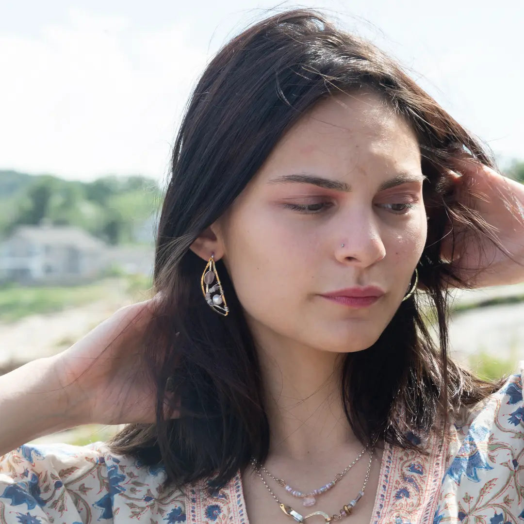 Leaf stamped brass semi circle earrings with sterling silver and gold filled wire details, featuring rose quartz, pink tourmaline, pink opal, and a pink fresh water pearl with built in earring hooks that wear like a post earring