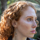 hammered brass points hanging from delicate sterling silver chain with oxidized sterling silver twist and faceted garnet gemstones earrings