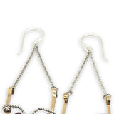 hammered brass points hanging from delicate sterling silver chain with oxidized sterling silver twist and faceted garnet gemstones earrings