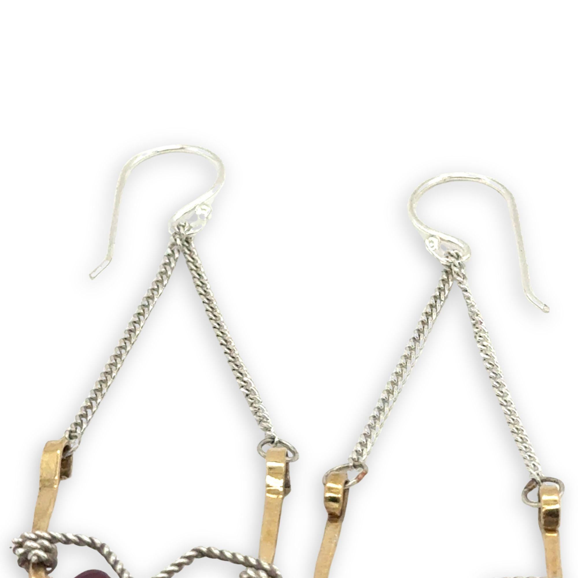hammered brass points hanging from delicate sterling silver chain with oxidized sterling silver twist and faceted garnet gemstones earrings