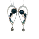 A pair of sterling silver drop earrings with gold-filled wiring and dark green faceted bloodstone and blue tourmaline gemstones with silver pyrite drops.