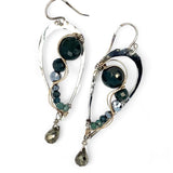 A pair of sterling silver drop earrings with gold-filled wiring and dark green faceted bloodstone and blue tourmaline gemstones with silver pyrite drops.