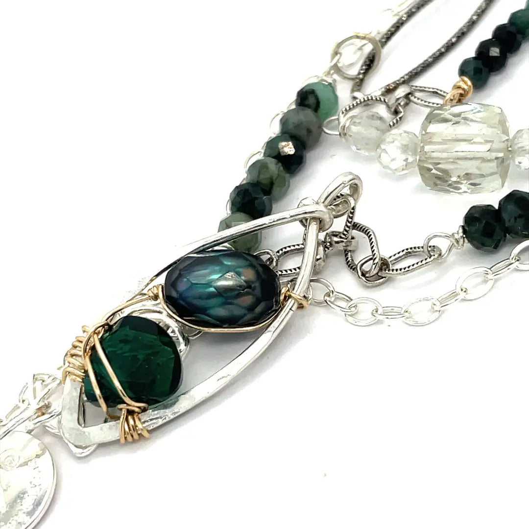 A sterling silver double chain necklace with adjuster, featuring dark green fresh water pearl, dark green amethyst drop, faceted blue tourmaline ombre gemstones, green amethyst, and oxidized sterling silver diamond cut links 