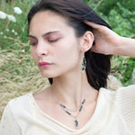 A sterling silver double chain necklace with adjuster, featuring dark green fresh water pearl, dark green amethyst drop, faceted blue tourmaline ombre gemstones, green amethyst, and oxidized sterling silver diamond cut links 