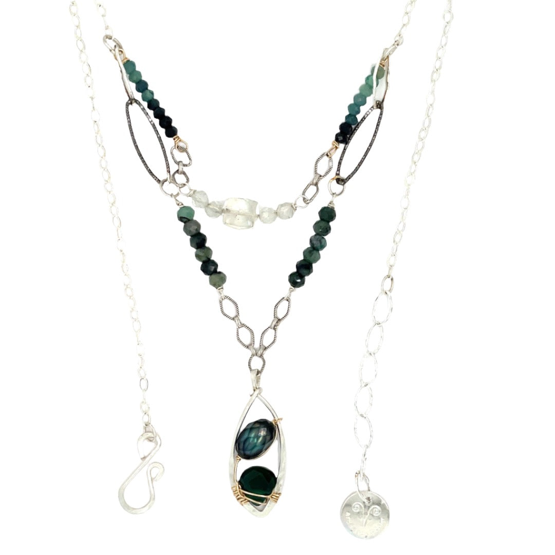A sterling silver double chain necklace with adjuster, featuring dark green fresh water pearl, dark green amethyst drop, faceted blue tourmaline ombre gemstones, green amethyst, and oxidized sterling silver diamond cut links 