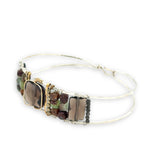 Smokey quartz tile center surrounded by pyrite, chrysoprase, and smokey quartz rectangle gemstones on a sterling silver cuff bracelet